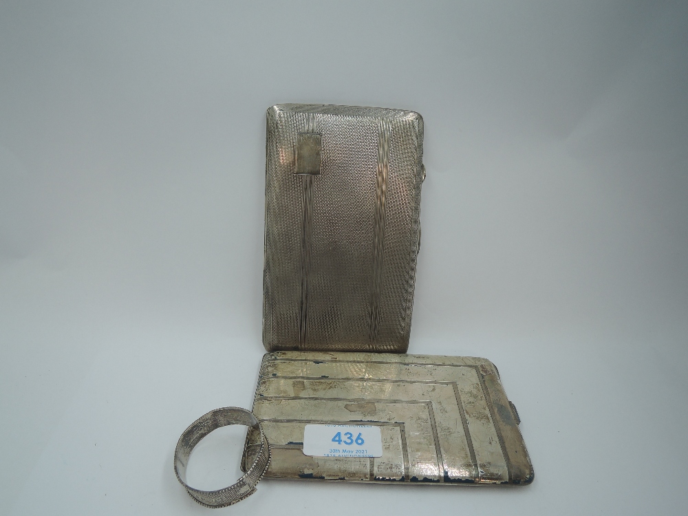 A silver cigarette case having engine turned stripe decoration and plain cartouche, Birmingham 1943,