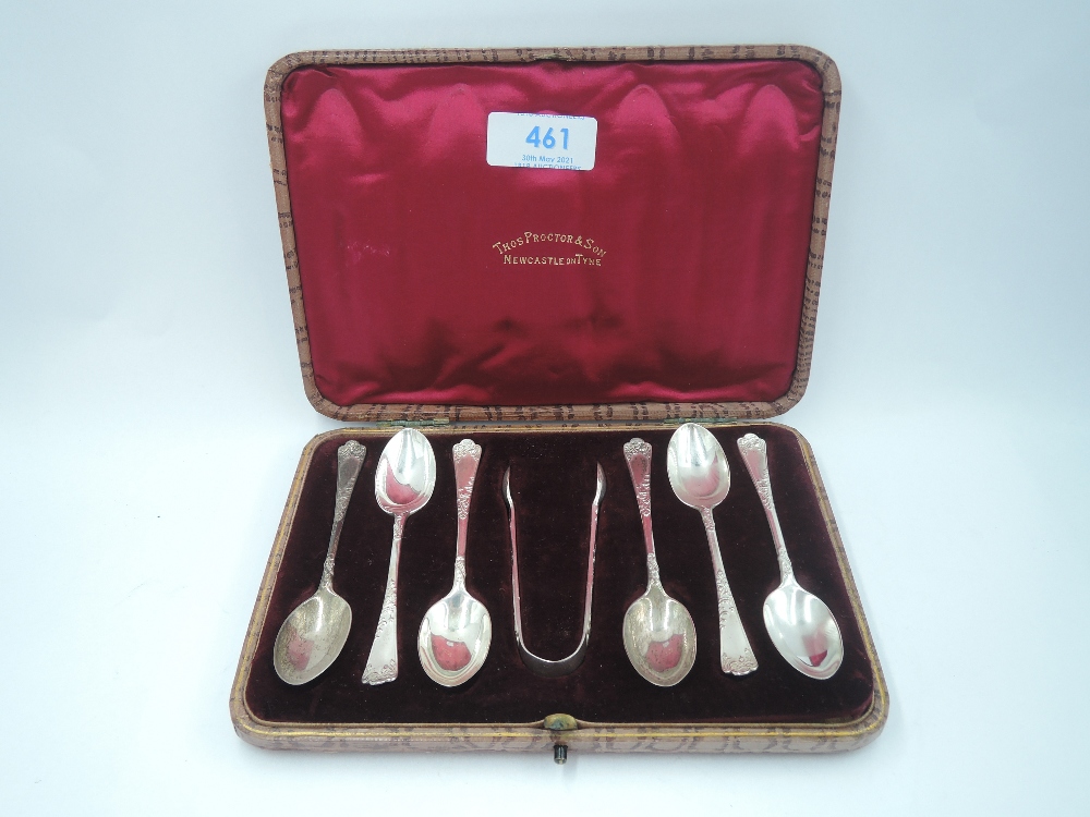 A cased set of Edwardian silver teaspoons and matching sugar nips having moulded decoration to