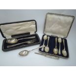 A selection of HM silver including a cased child's spoon and fork, part set of teaspoons having golf