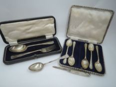 A selection of HM silver including a cased child's spoon and fork, part set of teaspoons having golf