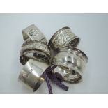 Five HM silver napkin rings of various forms, approx 108g