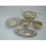 Five pieces of HM silver including two trinket dishes of small boat form having pierced