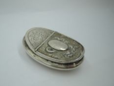 An early 20th Century Chinese silver snuff box of curved oval form having engraved dragon to base