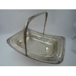 A Victorian silver table basket of plain rectangular form having moulded and gadrooned rim, plain