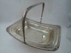 A Victorian silver table basket of plain rectangular form having moulded and gadrooned rim, plain