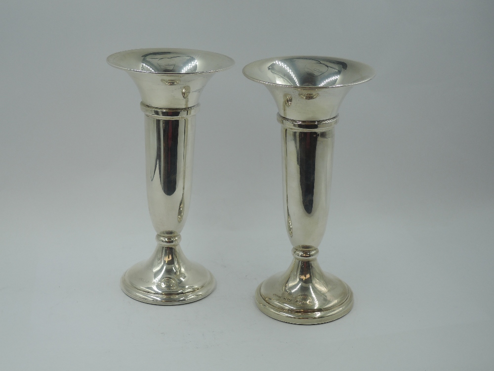 A pair of silver stem vases of plain traditional trumpet form having weighted bases, Birmingham
