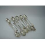 Ten Victorian/Edwardian silver teaspoons of Old English form having scallop shell terminals and