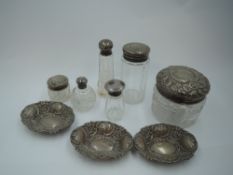 Three small HM silver trinket dishes of boat form having repousse decoration and six glass