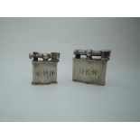 Two Mexican silver cigarette lighters, both of same design and having engraved initials to sides