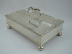 An Edwardian Scottish silver ink stand of plain rectangular form having reeded rims, swing handle