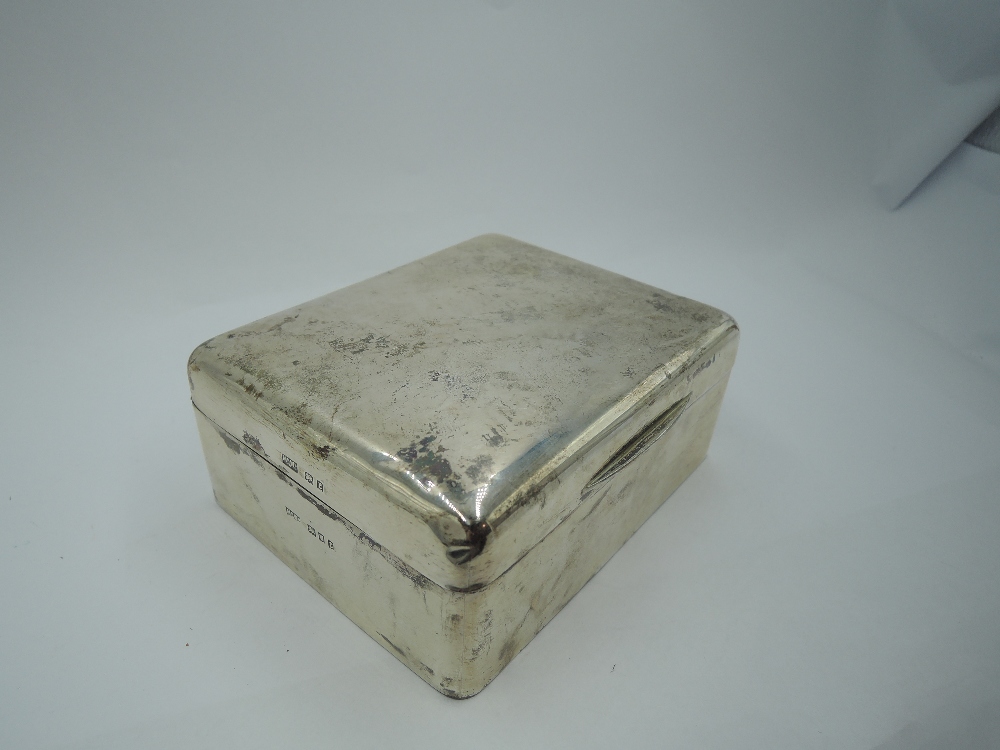 A silver cigarette box of plain rectangular form, London 1920, Mappin & Webb, GW approx 326.1g (some