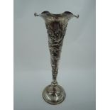 A late 19th/early 20th century Chinese silver bud vase of trumpet form having lotus flower and