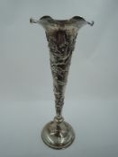 A late 19th/early 20th century Chinese silver bud vase of trumpet form having lotus flower and