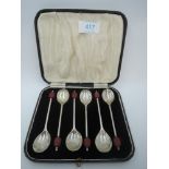 A cased set of six silver coffee spoons having red coffee bean knops, Sheffield 1938, Viner's Ltd,