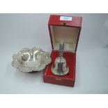 A cased silver table bell having a pierced decorative handle, Birmingham 1980, Laurence R Watson &