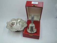 A cased silver table bell having a pierced decorative handle, Birmingham 1980, Laurence R Watson &