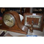 Two art deco mantle clocks one having geometric design and similar Napoleonic style