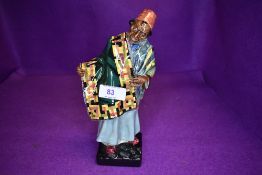 A Royal Doulton figure, Carpet Seller HN 1464