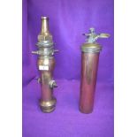 A vintage brass fire nozzle'The London Nozzle,John Morris & Sons,Fire Engineers, Manchester' and a