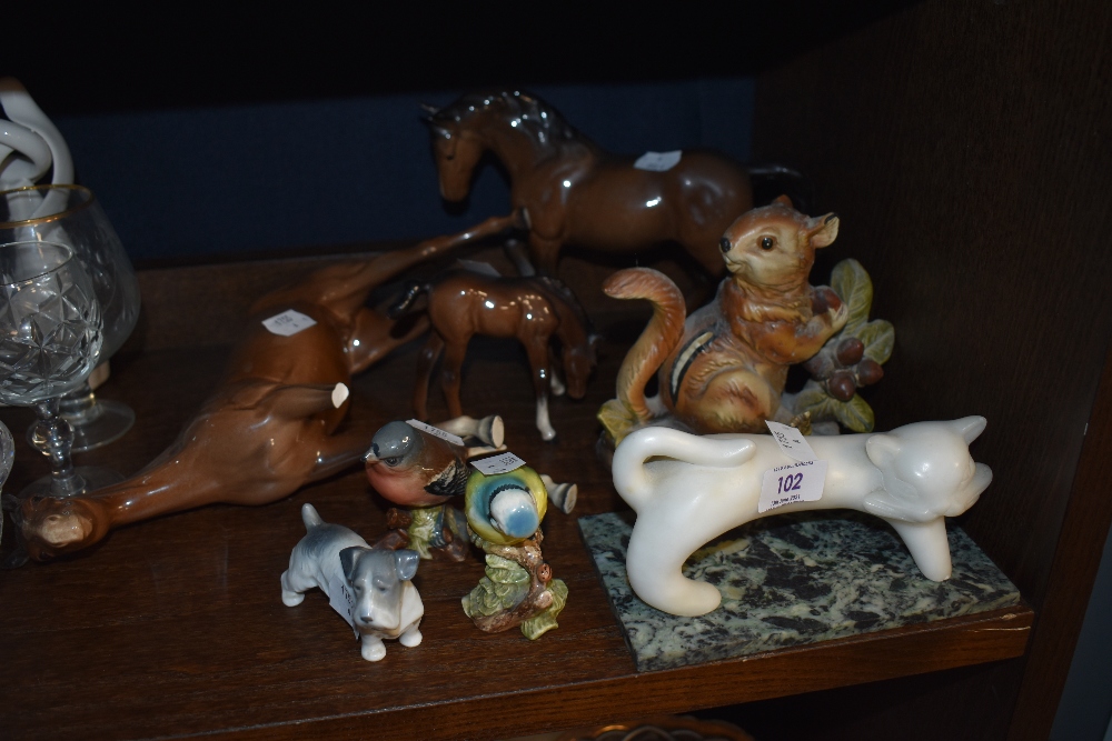 A collection of animal figurines including Beswick blue tit and chaffinch, Royal Doulton pony and