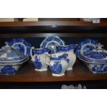 A selection of antique blue and white tureens,plates and graded jugs.