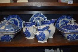 A selection of antique blue and white tureens,plates and graded jugs.