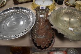 A selection of metal wares including fish shaped moulds and pressed leaf dish