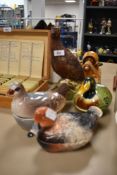 A selection of bird themed ceramics including Royal Doulton grouse decanter and a set of three ha