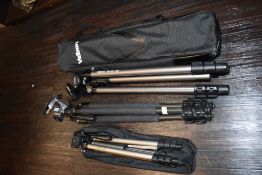 A collection of tripods or varying size including Velbron.