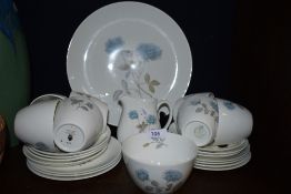 A collection of Wedgwood having blue rose pattern included are cups and saucers, plates and more.