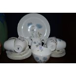 A collection of Wedgwood having blue rose pattern included are cups and saucers, plates and more.
