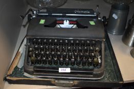 An Olympia typewriter in case olive green