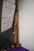 Two antique copper and brass fire nozzles.