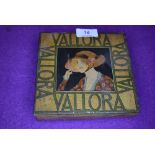 A sought after art deco Vallora'100 Viginia special' tin depicting lady in period costume with