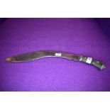 A Indian/Nepalese Kukri having chased detail to blade and inlaid metal work to bone handle.