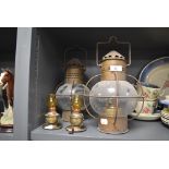 An assortment of oil lamps/storm lamps.