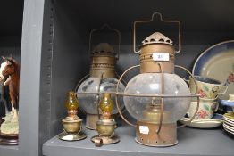 An assortment of oil lamps/storm lamps.
