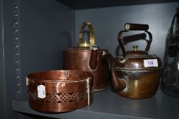Two copper kettles and a burner or similar.