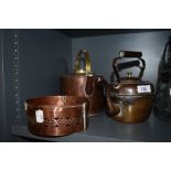 Two copper kettles and a burner or similar.