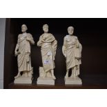 Three Greek figurines including Socrates.