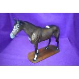 A Beswick study, Large Racehorse, brown, model no 1564, fixed to a home made plinth