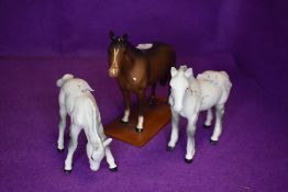 Three Beswick studies, Foal, grazing, grey, model no 946, Shire Foal, grey, model no 1053 and