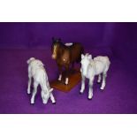 Three Beswick studies, Foal, grazing, grey, model no 946, Shire Foal, grey, model no 1053 and