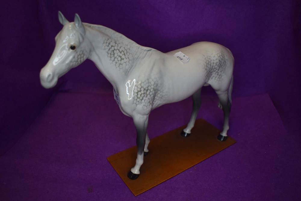 A Beswick study, Large Racehorse, grey, model no 1564, fixed to a home made plinth
