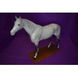 A Beswick study, Large Racehorse, grey, model no 1564, fixed to a home made plinth