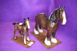 Two Beswick studies, Shire Mare, brown 818 and Shire Foal, brown, 951, both on home made wooden