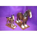 Two Beswick studies, Shire Mare, brown 818 and Shire Foal, brown, 951, both on home made wooden