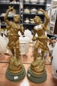 A pair of French spelter mantle garniture figures of maidens