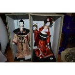Two mid century Japanese Hakata figures or dolls having original case and porcelain bodys