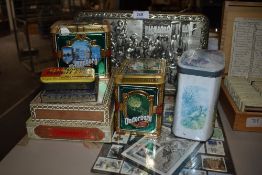 A selection of advertising tins and a set of stamps with Kew garden interest